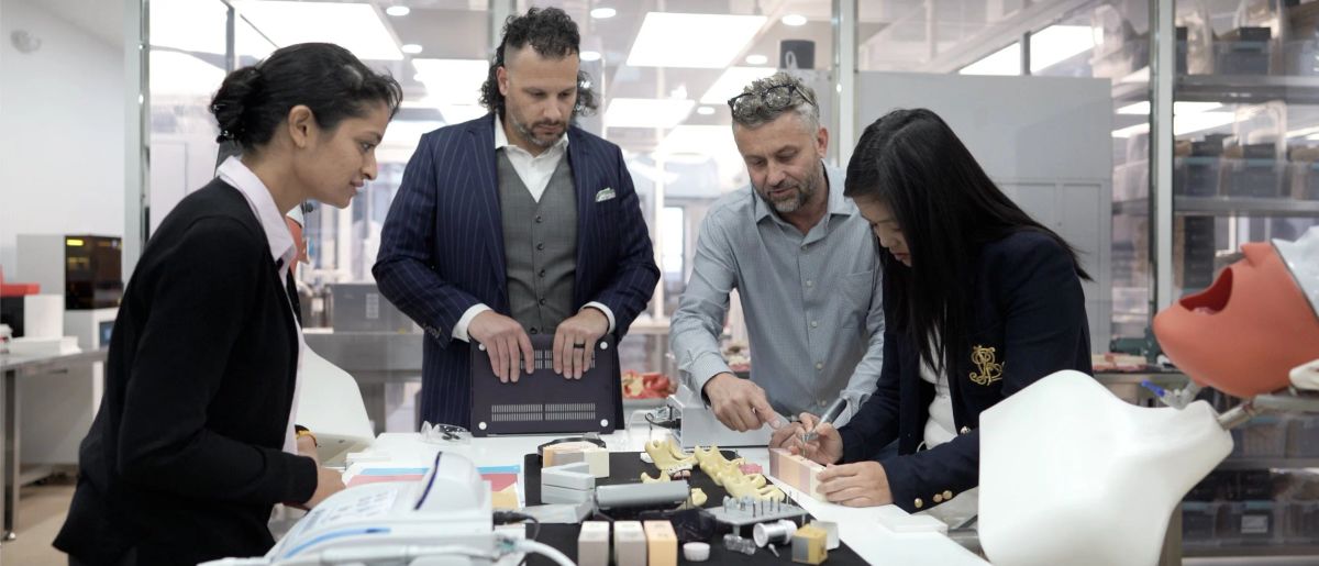 Valdi Blaszak with the OsseoPure team at the lab bench.